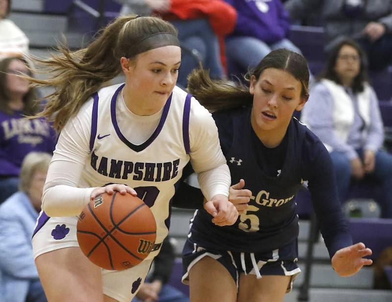 Hampshire's Chloe Van Horn pushes the ball up the court against Cary-Grove's Morgan Haslow during a Fox Valley Conference girls basketball game Friday, Jan. 26, 2024, at Hampshire High School.