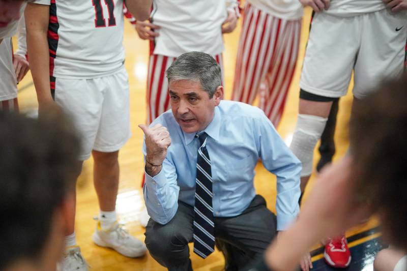 Benet’s head coach Gene Keidkemp talks to his team during a Class 4A Oswego East regional final basketball game against Oswego East at Oswego East High School on Friday, Feb 23, 2024.