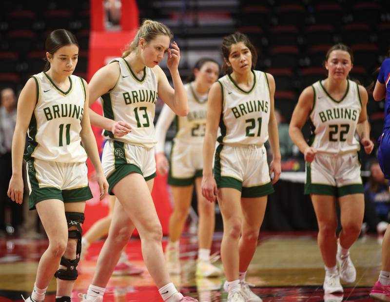 Members of the St. Bede girls basketball team (from left) Bailey Engeles, Ashlyn Ehm, Ali Bosnich and Elle Hermes walk off of the floor after losing to Okawville in the Class 1A State semifinal game on Thursday, Feb. 29, 2024 at CEFCU Arena in Normal.