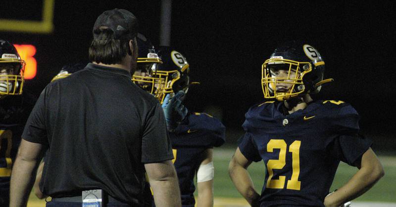 A Sterling player listens to a coach following a play against Rock Island. Action took place on Friday, October  18th, 2024 in Sterling.