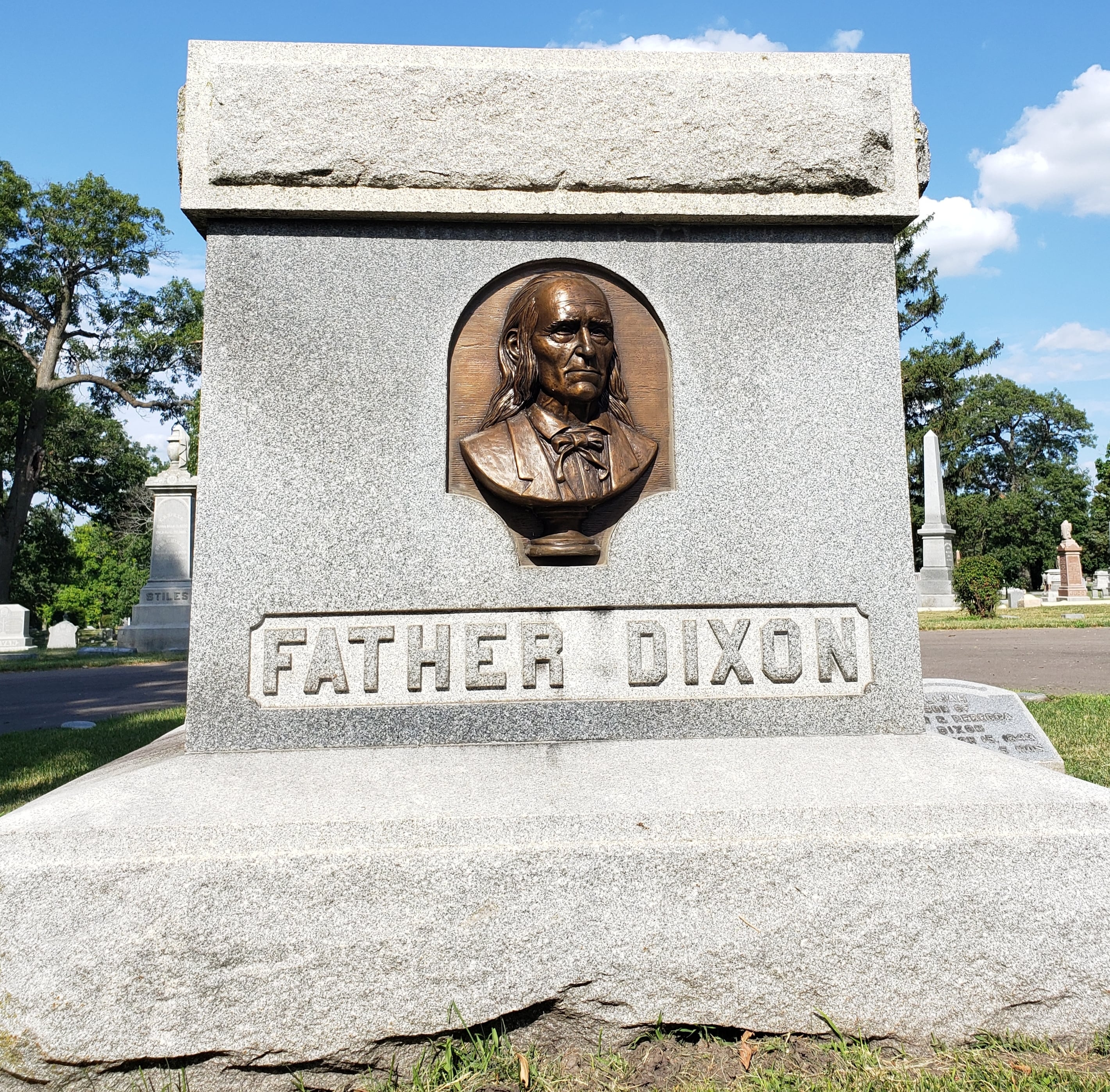 In 1893, citizens erected the Father Dixon monument, which greets all who enter Oakwood Cemetery.