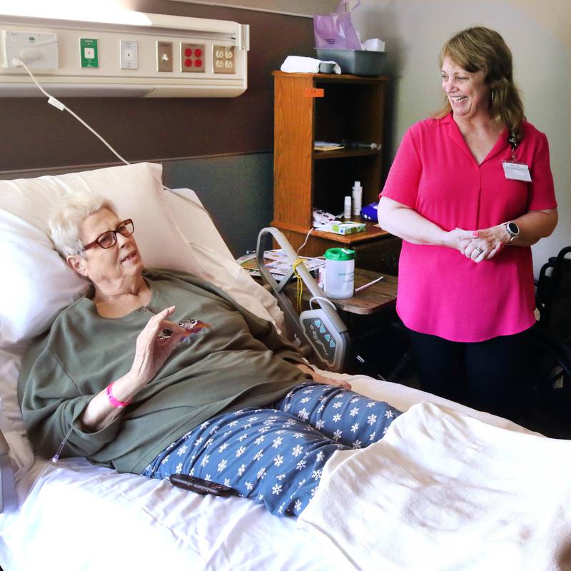 Maretta "Mikki" Bell, 78, one of the first residents to move into the DeKalb County Rehabilitation and Nursing Center’s new transitional care wing, tells Mary Anne Miller, social service director at the facility, what her favorite features are in her new room Wednesday, July 10, 2024, at the center in DeKalb.