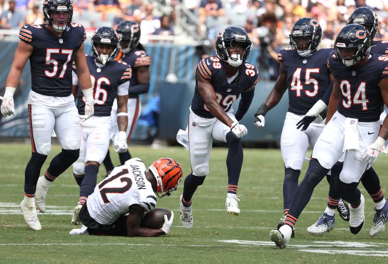 Chicago Bears cornerback Josh Blackwell (middle) celebrates after stopping Cincinnati Bengals wide receiver Shedrick Jackson during their game Saturday, Aug. 17, 2024, at Soldier Field in Chicago.