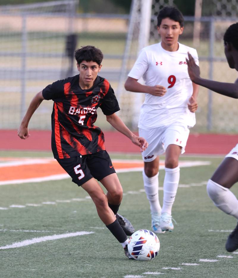 DeKalb's Erick Talamantes gets by Rockford East's Yael Marquez during their game Thursday, Sept. 12, 2024, at DeKalb High School.