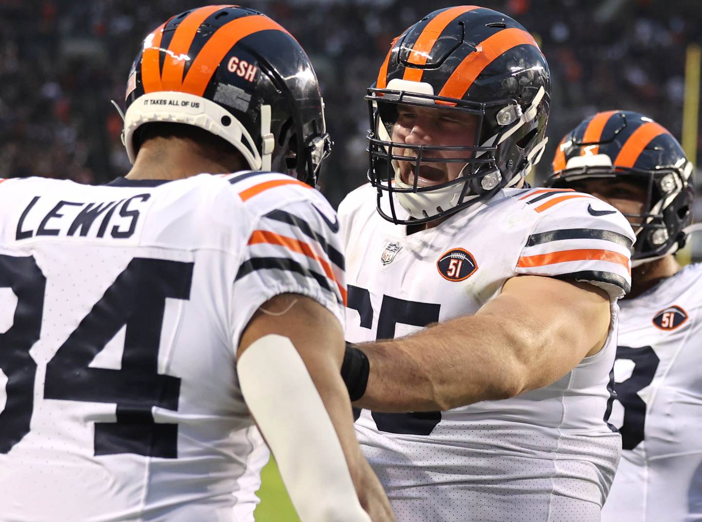 Chicago Bears tight end Marcedes Lewis celebrates his touchdown catch with center Cody Whitehair during their game against the Arizona Cardinals Sunday, Dec. 24, 2023, at Soldier Field in Chicago.