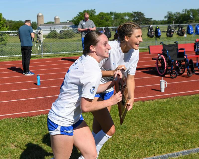 Wheaton North's Grace Kuczaj (13) and St. Charles North's Chloe Kirsten (10)  battle for the ball during the sectional title game held at South Elgin High School on Saturday May 25, 2024.