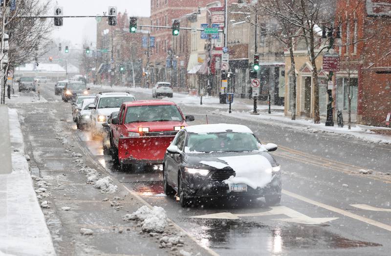 Vehicles travel through the snow on Lincoln Highway in this Shaw Local file photo on Tuesday, Jan. 9, 2024, in downtown DeKalb.