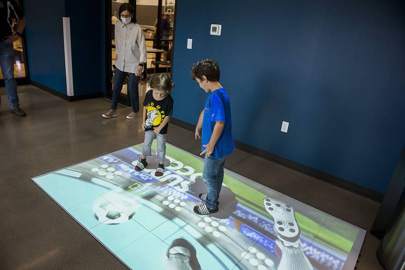 Oliver Garza (left), 4, and Lincoln, 5, of Dixon try out a new interactive gaming system at Dixon Park District’s Facility Friday, August 19, 2022. The system has over 100 gaming options for all ages that are can be both active and brain stimulating.