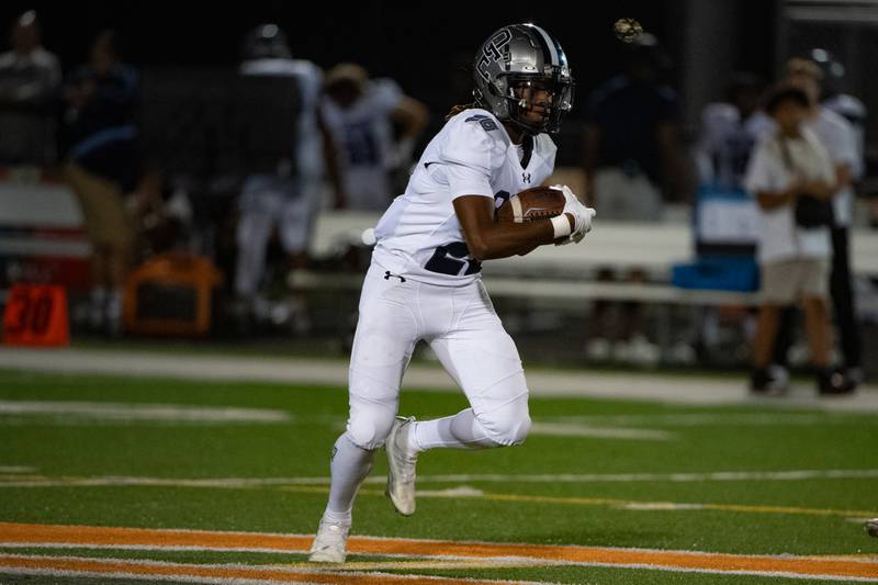 Oswego East's Ty'Rel Thomas runs the ball during a game against Plainfield East on Thursday Sept. 12, 2024 at Plainfield East High School