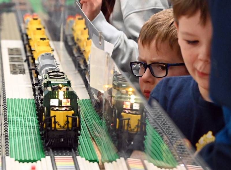 Second from right, Andrew Kramer, 6, of West Dundee views one of the model train displays exhibited Sunday, April 2, 2023, during the Northern Illinois Lego Train Club's expo at the Fox River Valley Public Library in East Dundee.