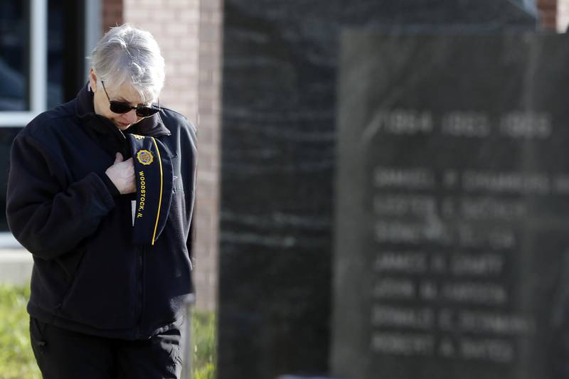 U.S. Army veteran Lou Ness bows her head as the names of McHenry County veterans who died in the Vietnam War are read during the “Voices from Vietnam,” program on Friday, March 29, 2024, at the McHenry County Government Administration Building in Woodstock. The program was the first time that McHenry County honored Vietnam veterans on Vietnam War Veterans Day. The day, that was created by federal law enacted in 2017, honors the more than 2.7 million American men and women who served in Vietnam.