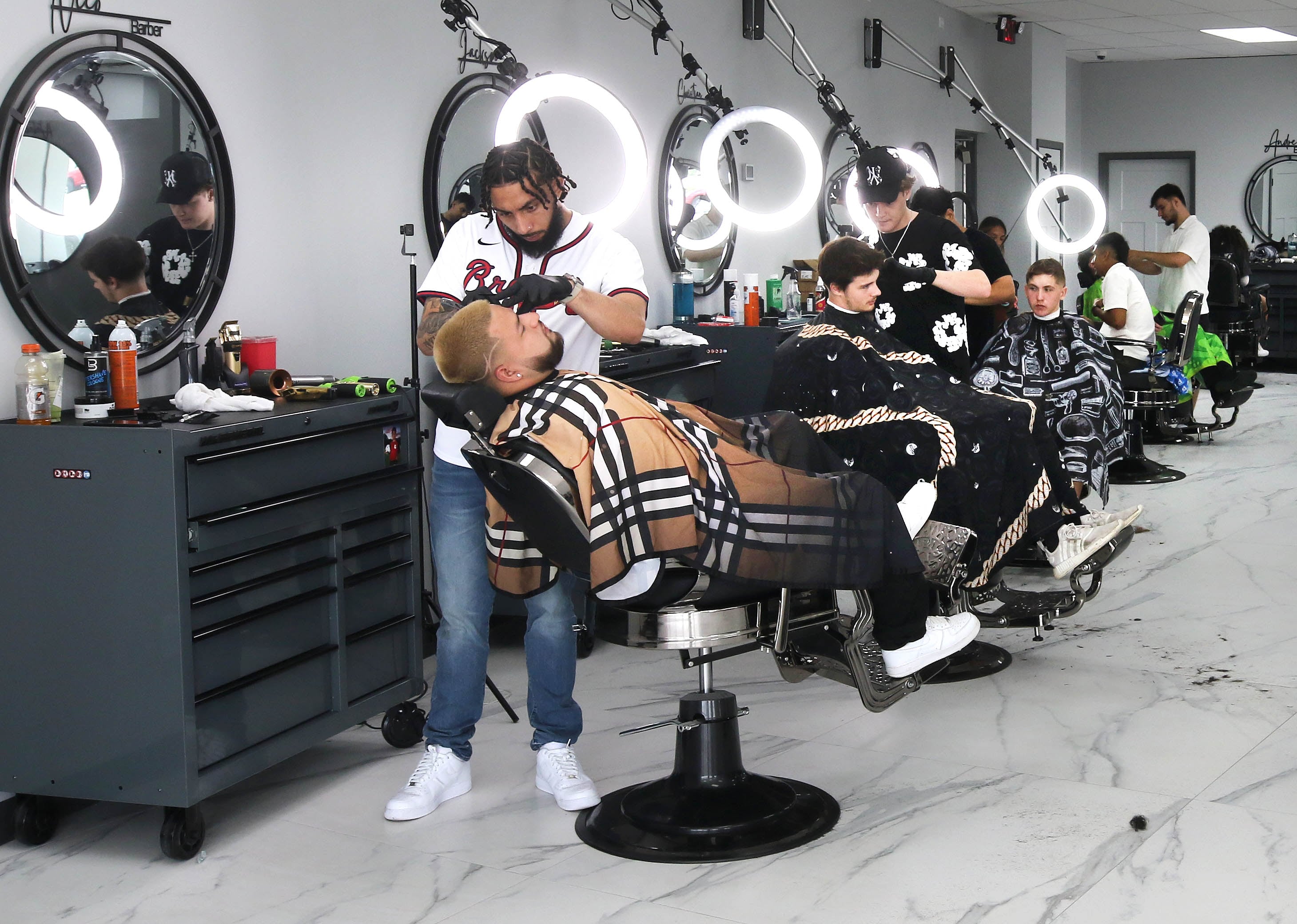 The interior of In & Out Cuts Barbershop, Friday, Aug 9, 2024, at the barbershop’s new location at 2331 Sycamore Road in DeKalb.