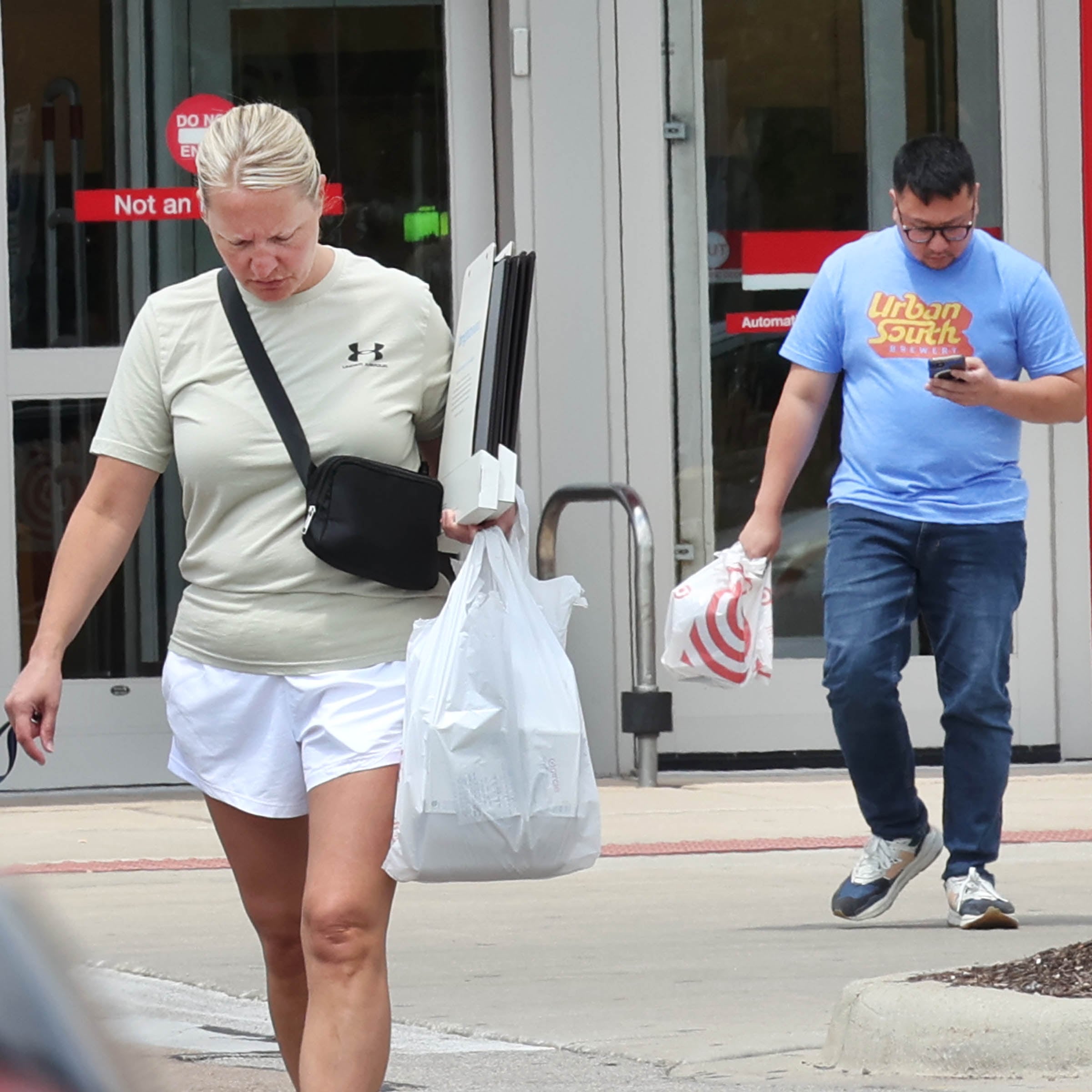 Shoppers exit the Target store Thursday, July, 18, 2024, on Sycamore Road in DeKalb.