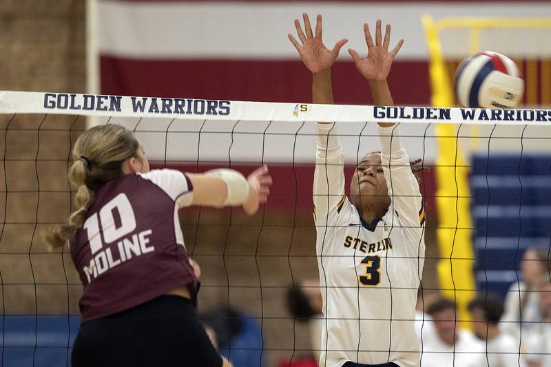 Sterling’s Delali Amankwa misses the block against Moline’s Bella Skeffington Tuesday, Sept. 10, 2024.