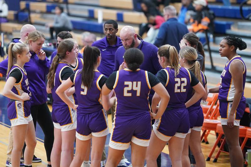 Downers Grove North's head coach Stephan Bolt talks to his team during a Oswego semifinal sectional 4A basketball game against Waubonsie Valley at Oswego High School on Tuesday, Feb 20, 2024.