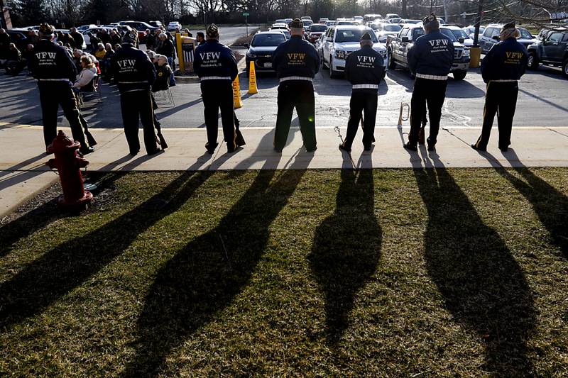 Members of the Woodstock Veterans of Foreign Wars Post 5040 Honor Guard cast long shadows during the “Voices from Vietnam,” program on Friday, March 29, 2024, at the McHenry County Government Administration Building in Woodstock. The program was the first time that McHenry County honored Vietnam veterans on Vietnam War Veterans Day. The day, that was created by federal law enacted in 2017, honors the more than 2.7 million American men and women who served in Vietnam.