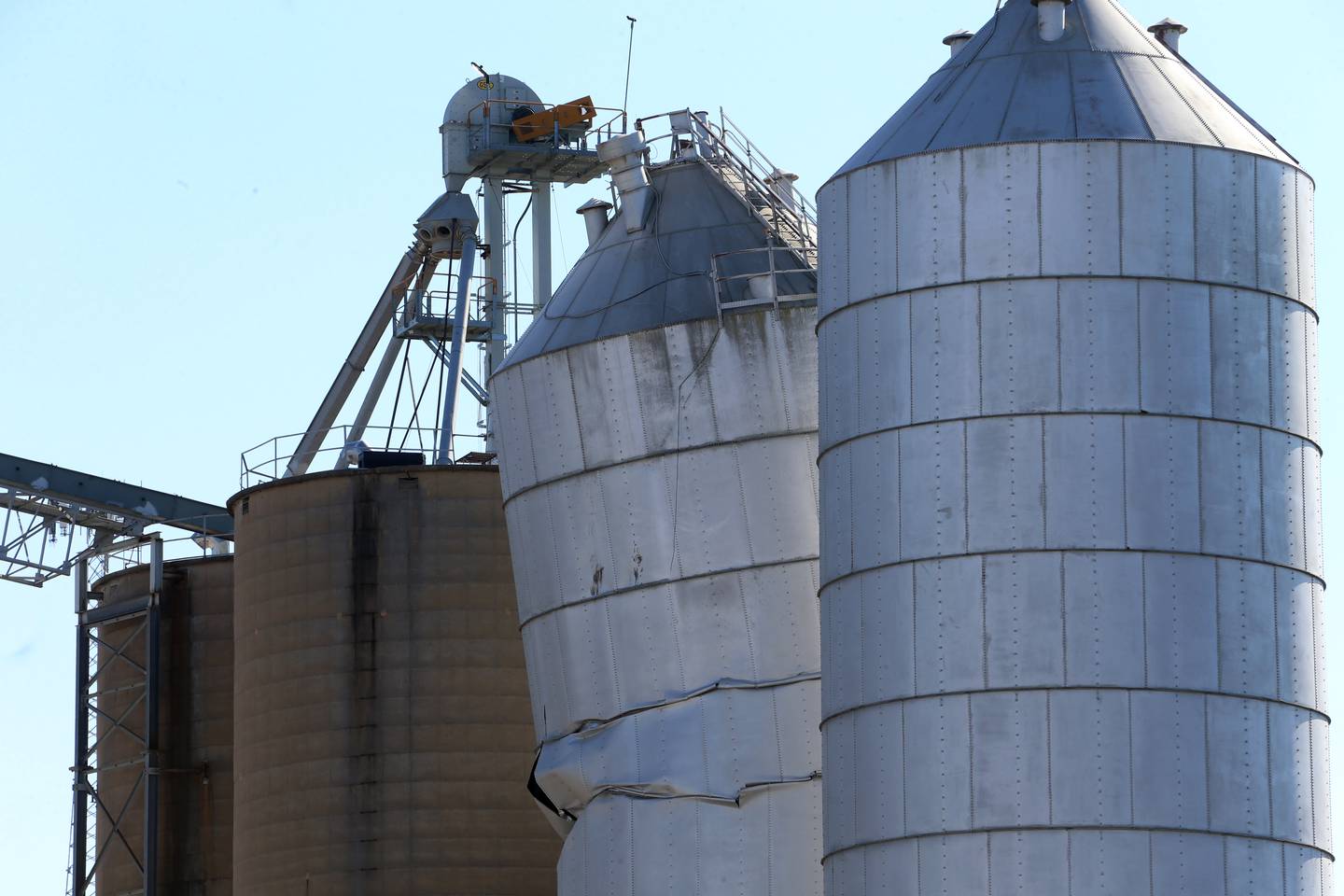 A grain silo buckles on Sunday, Oct. 20, 2024 from a partial collapse of a grain silo at the River Valley Coop Grain Elevator in Putnam.