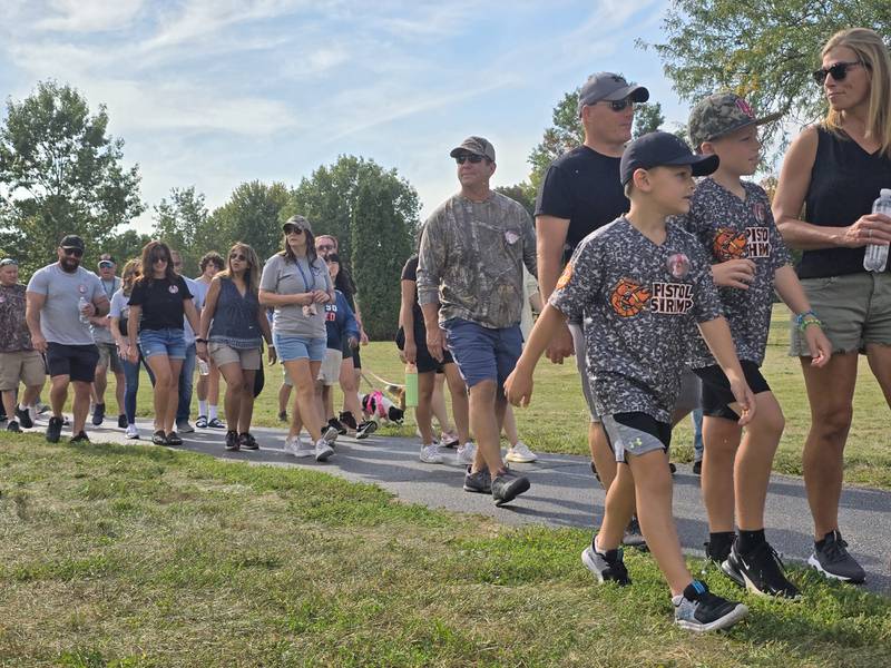 Walkers participate Sunday, Sept. 15, 2024, at the Compassionate Friends Walk to Remember at Baker Lake in Peru.