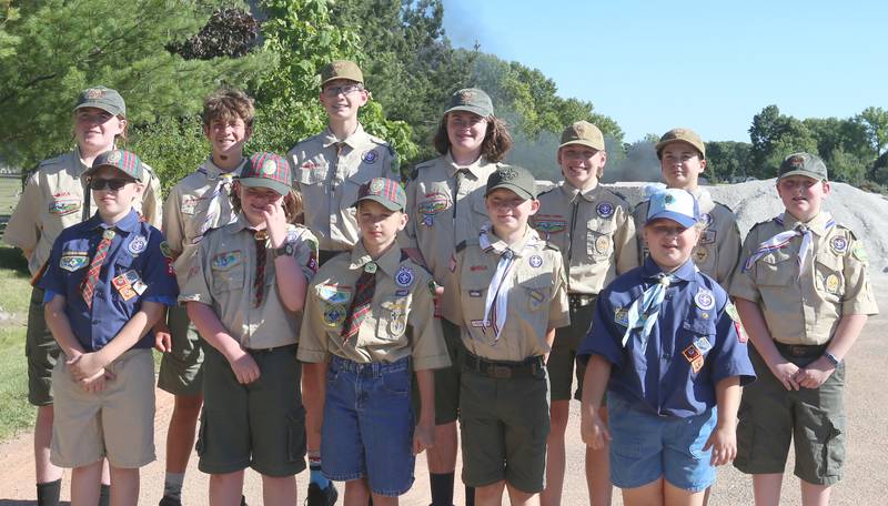 Boyscout from Troop 123 and Cub Scouts Pack 3709 pose for a photo during a Flag Retirement Ceremony on Friday, June 14, 2024 at Veterans Park in Peru.  The ceremony always takes place on Flag Day. It began as a Eagle Scout project for area boy scouts about 30 years ago. When an American Flag gets torn and tattered, Flag etiquette requires it to be proper disposed in a burning cauldron.