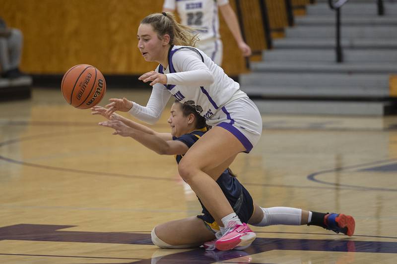 Dixon’s Reese Dambman has the ball knocked away by Sterling’s Joslynn James Tuesday, Feb. 13, 2024 during a regional semifinal at Rochelle.