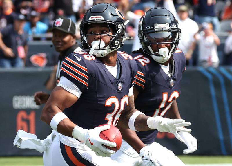 Chicago Bears safety Jonathan Owens looks back as he heads to the end zone after a blocked Tennessee Titans punt during their game Sunday, Sept. 8, 2024, at Soldier Field in Chicago.