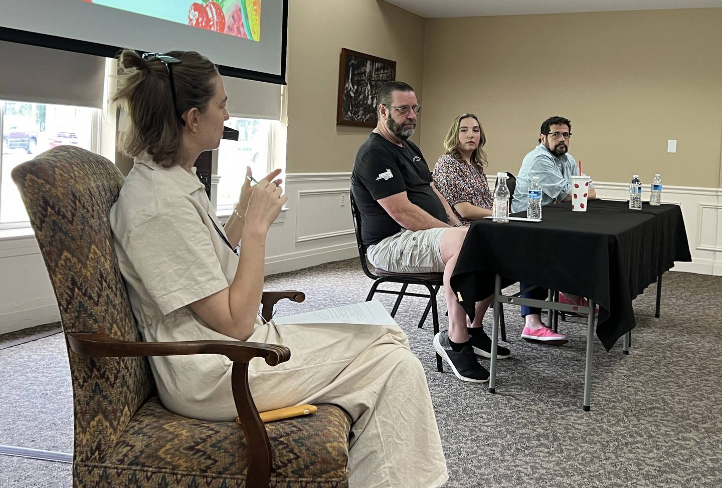 Ellwood House Curator of Education and Interpretation Aubrey King asks Dan Dietz, the owner of Slow Smoke BBQ & Catering; Virginia Filicetti, with DeKalb Chamber of Commerce; and Gavin Wilson, a former restaurateur turned insurance agent questions about the DeKalb Farmers' Market on May 2, 2024.