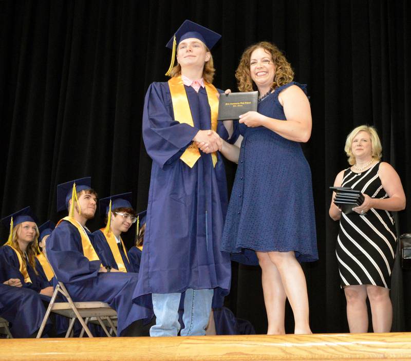 Polo Community High School senior Scott Robertson accepts his diploma from PCHS Board of Education member Jennifer Grobe during the Class of 2024's commencement ceremony on Sunday, May 19, 2024.