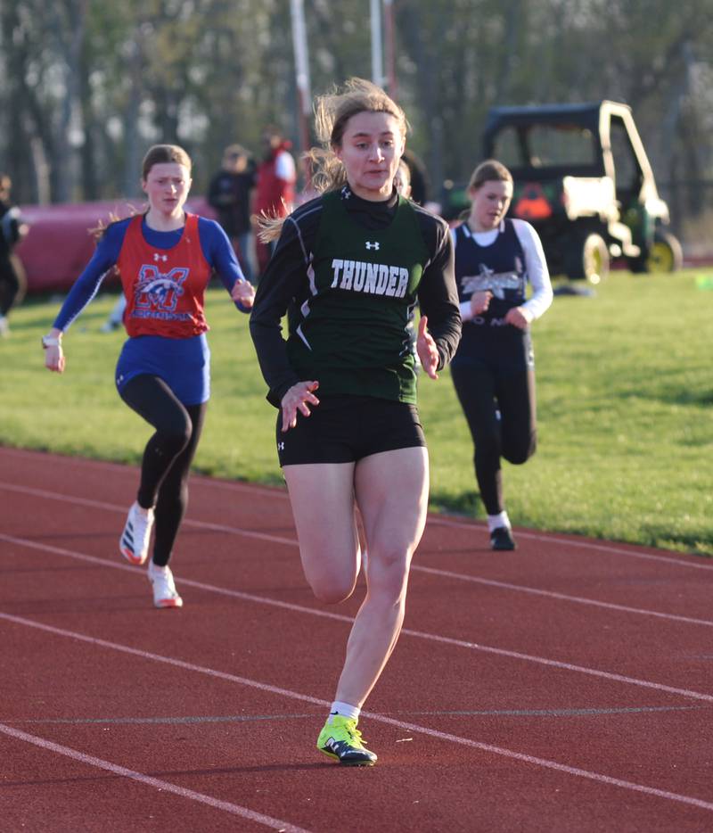 West Carroll's Emma Randecker leads the pack to the finish line in the 100 meters at the Ed Schmidt Invitational Track Meet at Erie High School on Friday, April 19, 2024.