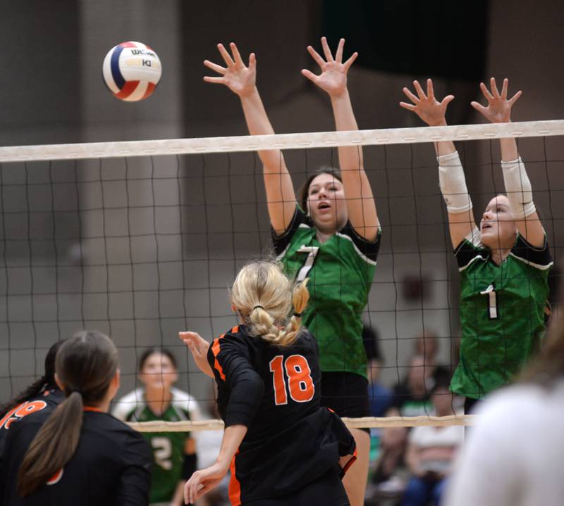 Rock Falls' Addison Miller (7) and Kacie Witherow (1) block against Winnebago during Saturday, Sept. 14, 2024 action at the Varsity Power Classic Tournament at Byron High School.