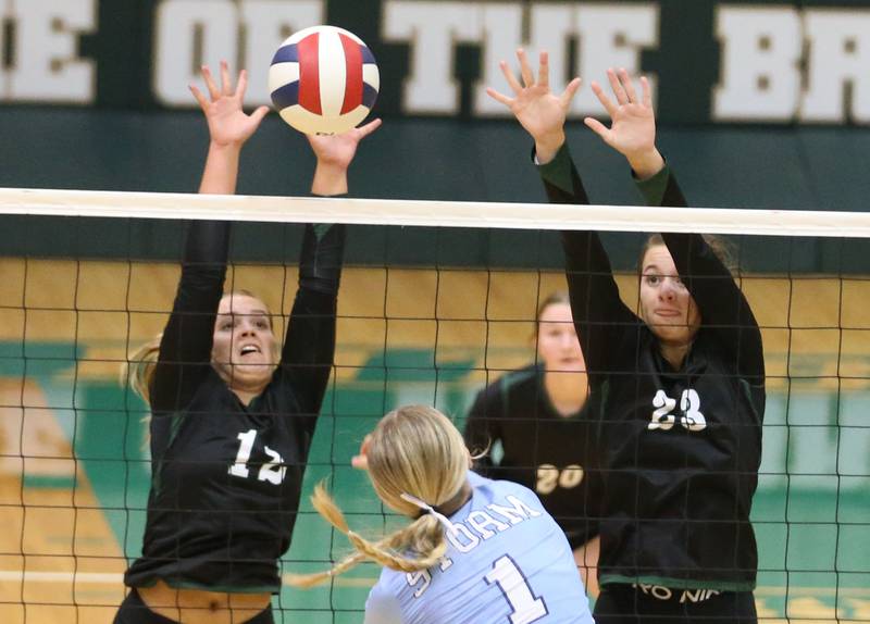 St. Bede's Sadie Koehler blocks a spike with the help of teammate Mary Quinn McClain from Bureau Valley's Kinley Canady on Monday, Sept. 9, 2024 at St. Bede Academy.