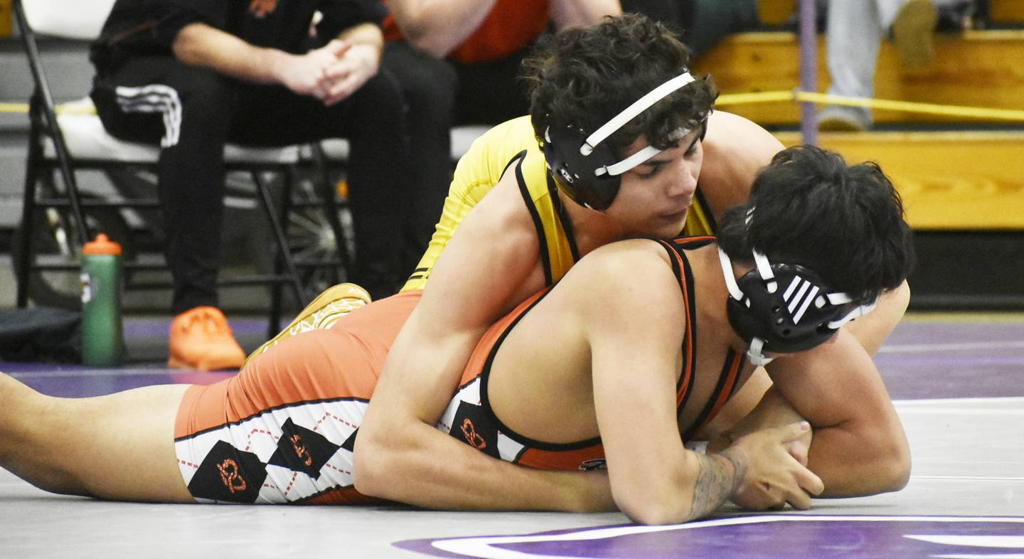 Harvard’s Daniel Rosas works against Freeport’s Donavyn Fernandez during the IHSA Class 2A Rochelle Wrestling Regional on Saturday, Feb. 3, 2024.