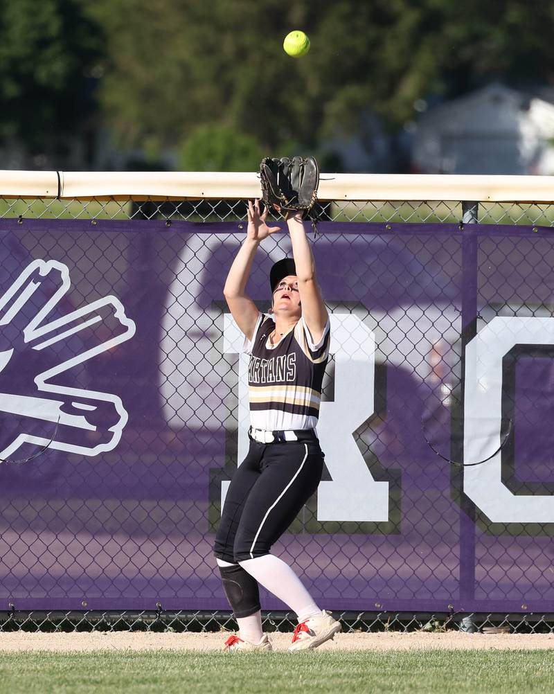 Sycamore's Addison McLaughlin catches a ball at the fence during their Class 3A regional final against Dixon Thursday, May 23, 2024, at Rochelle High School.
