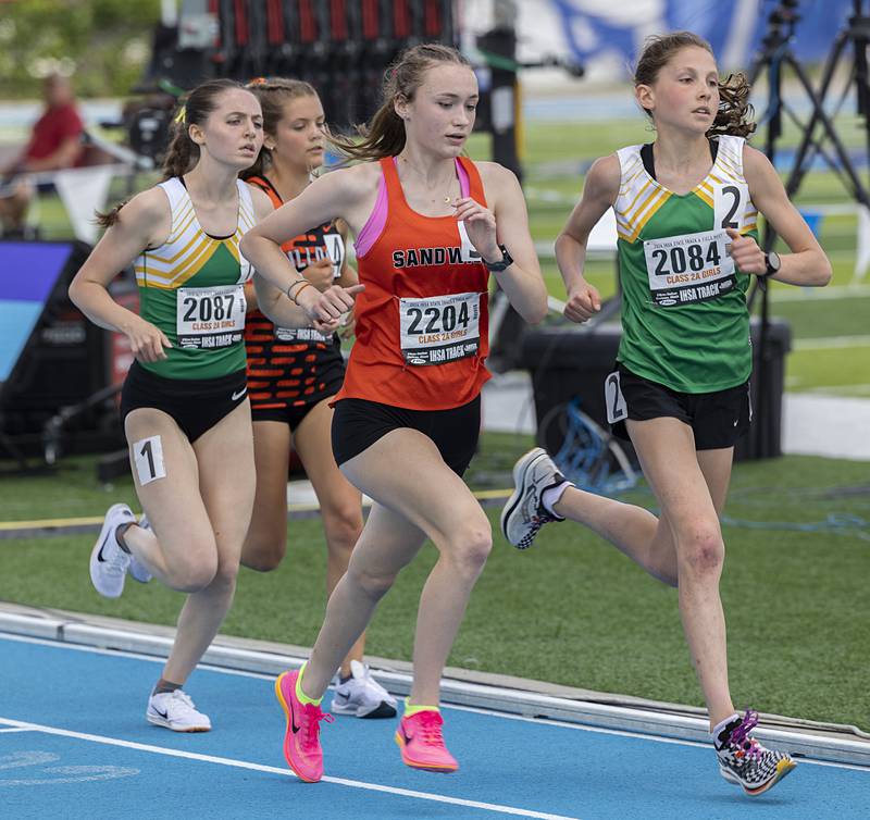 Sandwich’s Sunny Weber runs with a pack in the 2A 3200 run Saturday, May 18, 2024 at the IHSA girls state track meet in Charleston.