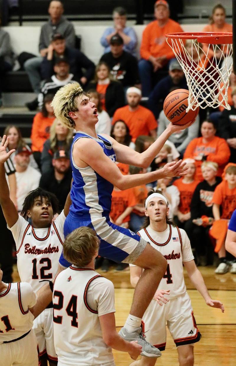 Princeton junior Noah LaPorte scores on a drive late in the third quarter in Tuesday's game at Kewanee. The Tigers fell in overtime 64-59.