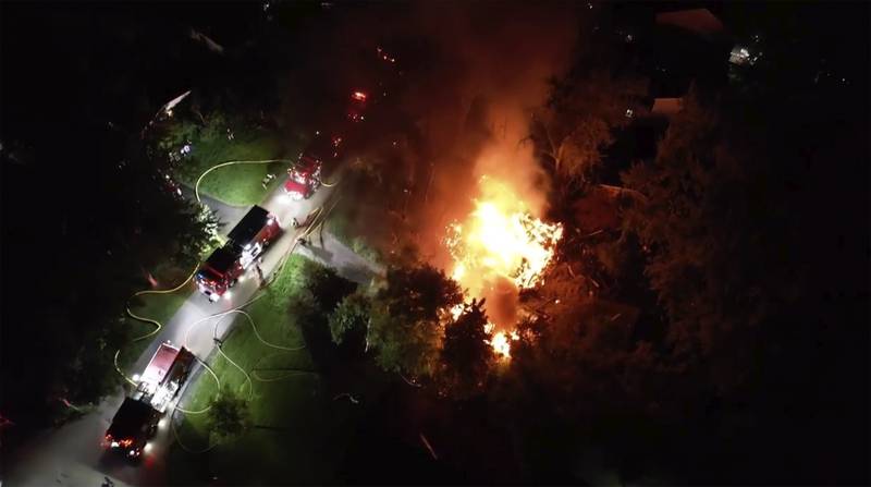 Firefighters work the scene of a home explosion Tuesday, June 4, 2024, near Lake Zurich. First responders found the home leveled after an explosion about 8:30 p.m. Tuesday, according to the Lake County Sheriff's Office.