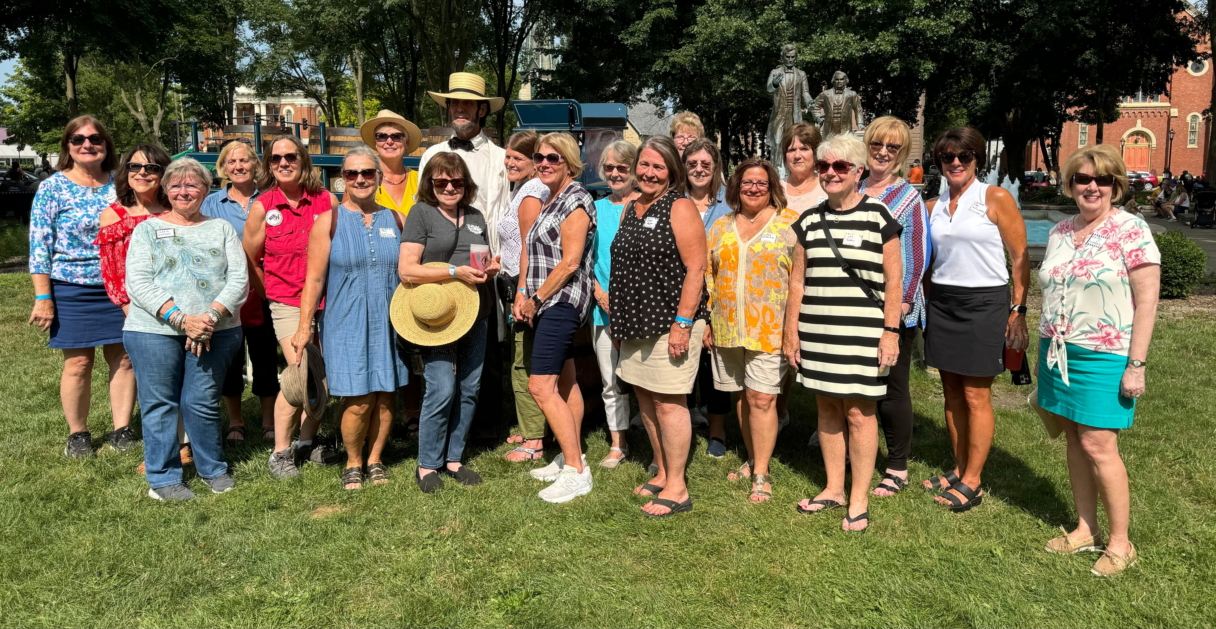 A group of Western Illinois University Lambda Chi Alpha fraternity brothers and their spouses had a reunion Saturday, July 27, at the Ottawa Drinkin’ with Lincoln Fest in Washington Square. The group of spouses pose with Abe Lincoln.