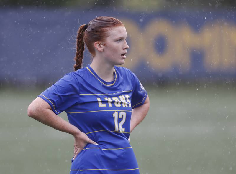 Lyons' Izzi Wirtz (12) waits for play to resume during the Class 3A Dominican super-sectional between New Trier and Lyons Township in River Forest on Tuesday, May 28, 2024.