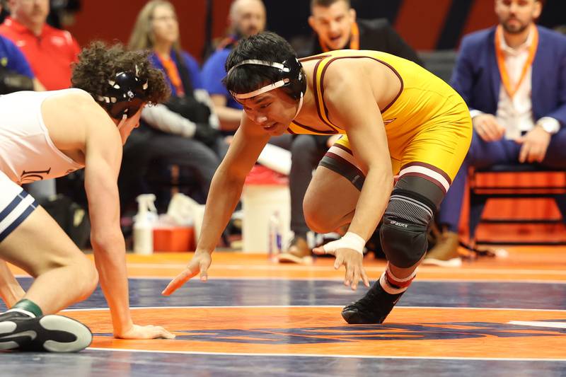Montini’s David Mayora spins away for a point against IC Catholic’s Brody Kelly in the 150-pound Class 2A state championship match on Saturday, Feb. 17th, 2024 in Champaign.