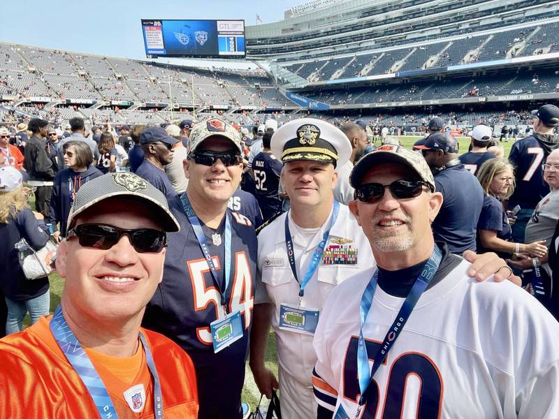 Princeton native Kristian Wahlgren was recognized during Sunday's Chicago Bears-Tennessee Titans game at Soldier Field for his retirement after 25 years of service for the U.S. Navy. Wahlgren (second from right) was accompanied on the field by his brothers, Kipp (from left), Kai, and Erick. All four are former Princeton High School football players.