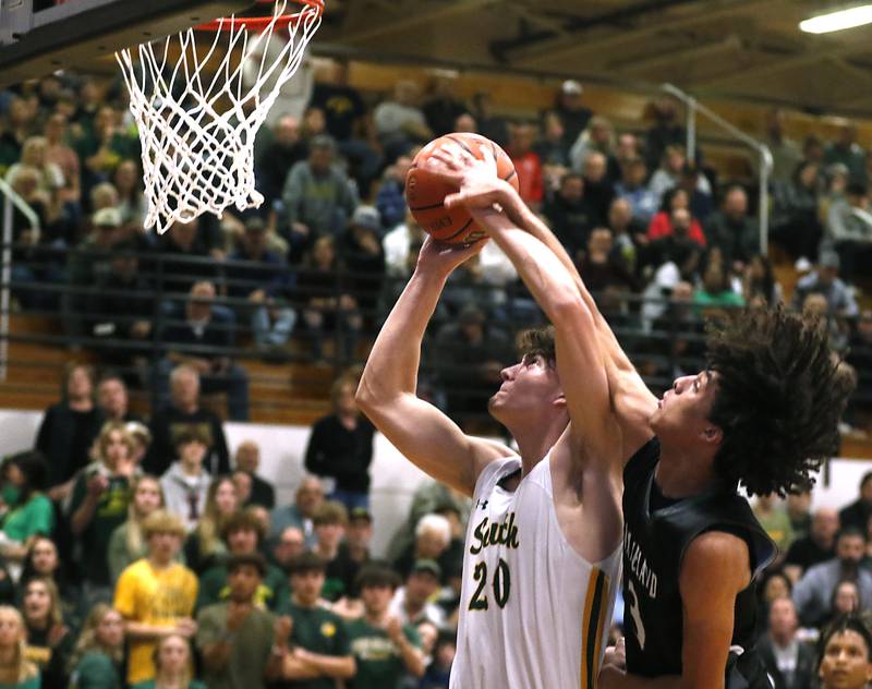 Crystal Lake South's Christopher Regillio is found by Kaneland's Evan Frieders as he drives to the basket during the IHSA Class 3A Kaneland Boys Basketball Sectional championship game on Friday, March 1, 2024, at Kaneland High School in Maple Park.