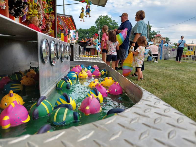 Families played games on the carnival midway Thursday, June 27, 2024, at the Sheffield Summer Festival in West Park.