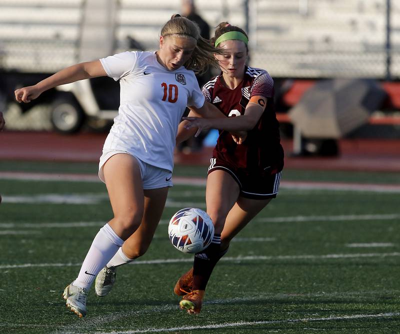 Crystal Lake Central's Brooklynn Carlson controls the ball as she tries to take a shot against St. Ignatius College Prep's Quinn Urquhart during the Class 2A Deerfield Supersectional girls soccer match on Tuesday, May 28, 2024, at Deerfield High School.