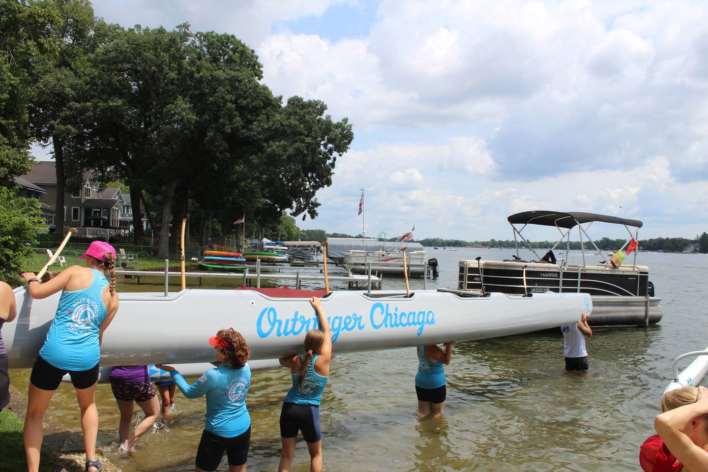 Outrigger Chicago members gather at founder Brian Jeffries' home in Crystal Lake to take the 40-foot-long canoes out for the first time.