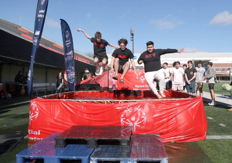 Members of the Phi Kappa Psi fraternity jump into the water on a cold and windy Saturday, Feb 17, 2024, during the Huskie Stadium Polar Plunge at Northern Illinois University in DeKalb. The Polar Plunge is the signature fundraiser for Special Olympics Illinois.