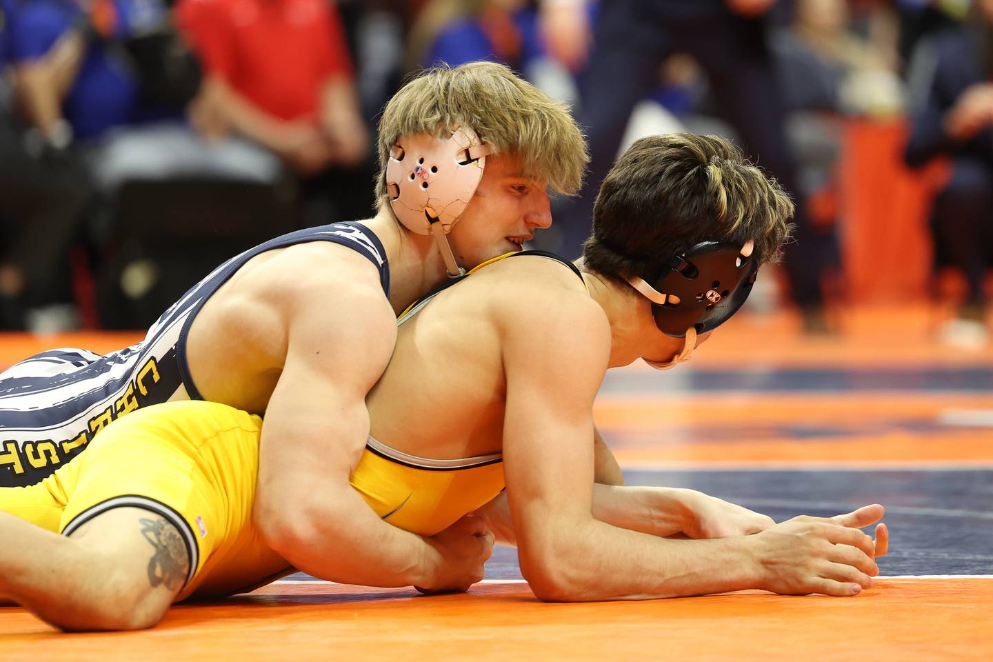 Yorkville Christian’s Ty Edwards stays over Galesburg’s Sauge Shipp in the final seconds of his win in the 132-pound Class 2A state championship match on Saturday, Feb. 17th, 2024 in Champaign.