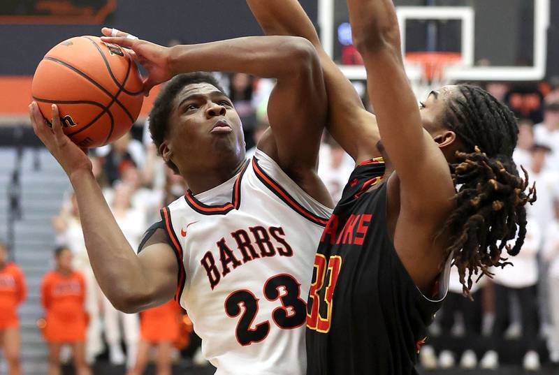 DeKalb’s Davon Grant tries to score over Jefferson's Cortez Christmas Wednesday, Feb. 21, 2024, during their Class 4A regional semifinal game at DeKalb High School.