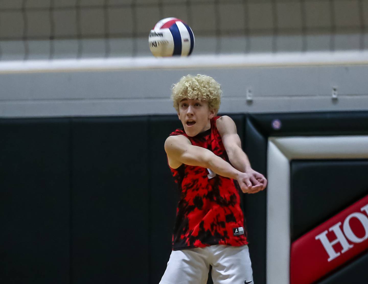 Bolingbrook's Tyler Vasquez (1) comes up with a dig save during volleyball match between Neuqua Valley at Bolingbrook.  April 1, 2024.