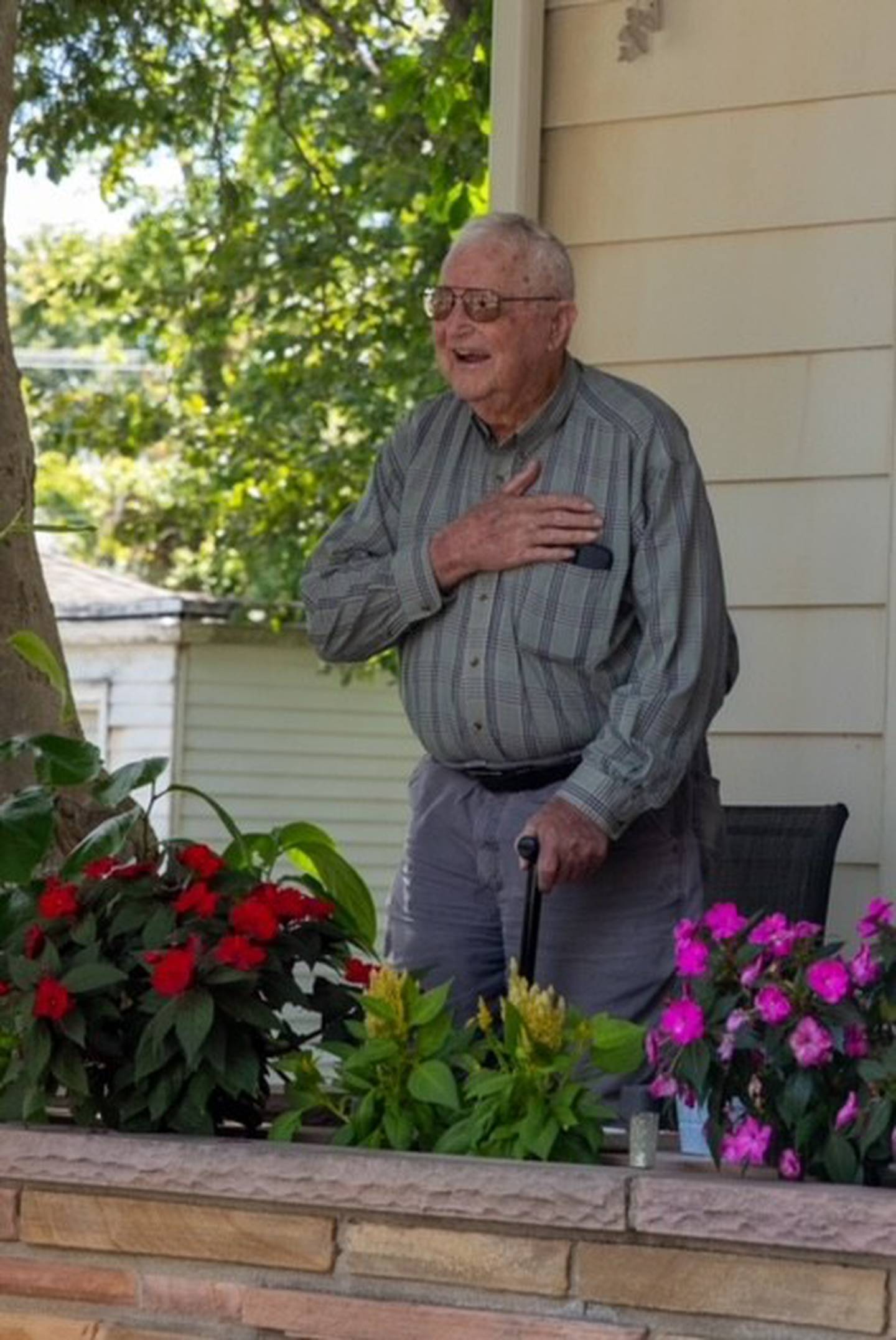 Willard Simpson of Franklin Grove reacts with surprise Sunday, Aug. 11, 2024, as Mendota veterans greet him during his visit to the Sweet Corn Festival. Simpson, who turns 100 on Sept. 3, participated in the Battle of the Bulge and his girlfriend, Deana Falchook of Mendota, felt it deserved praise from local veterans. VFW Post 4079 agreed and made a detour from the Sweet Corn procession to greet Willard.