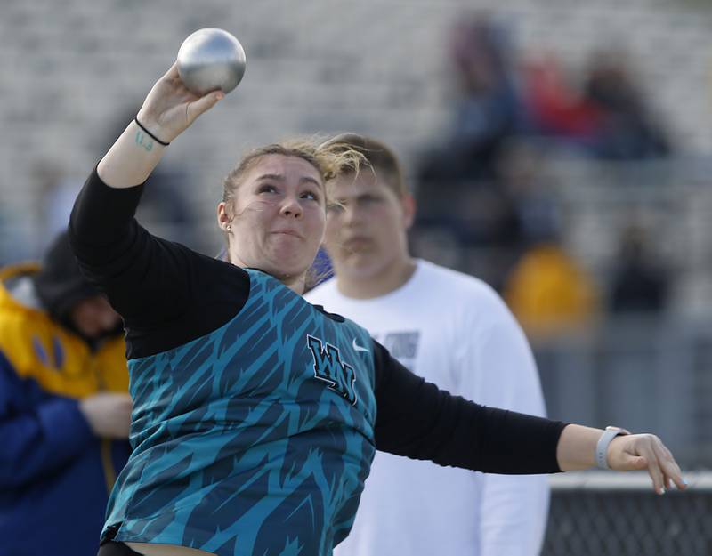 Woodstock North’s Ashley Janeczko throws the shot putt Friday, April 21, 2023, during the McHenry County Track and Field Meet at Cary-Grove High School.