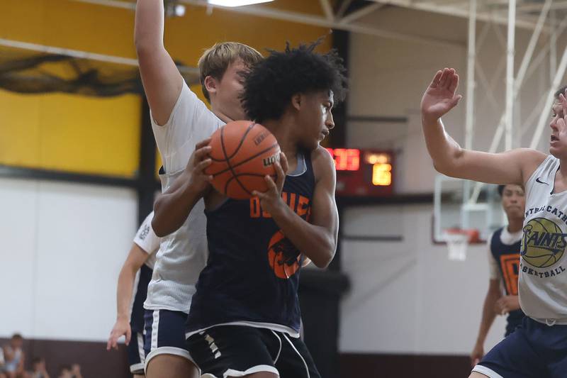 Oswego’s Dasean Patton looks to make a play against Central Catholic at the 37th Morris Boys Shootout on Tuesday, June 25, 2024.